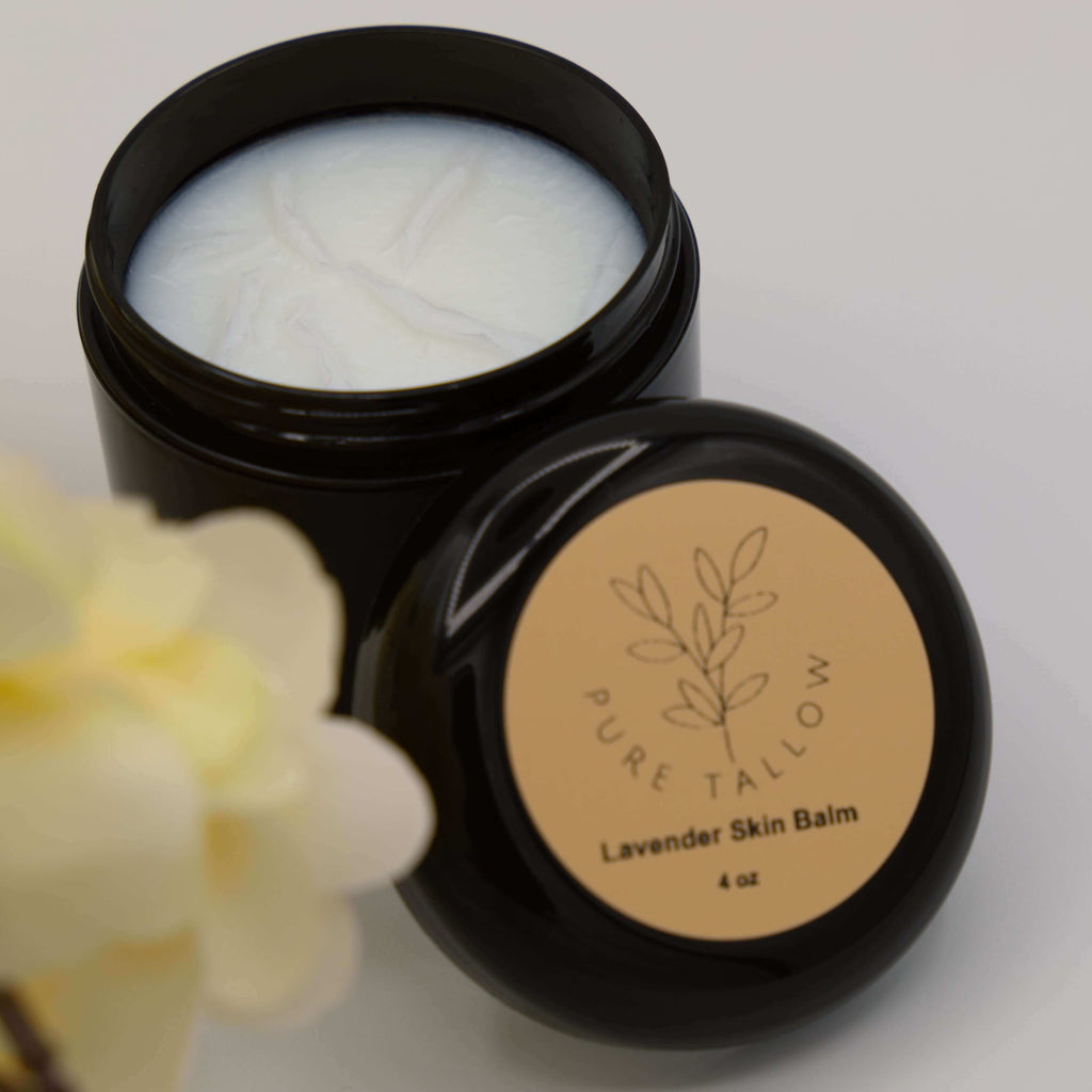 Black jar of lavender skin balm with 'Pure Tallow' label on a light background