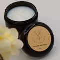 Black jar of lavender skin balm with 'Pure Tallow' label on a light background
